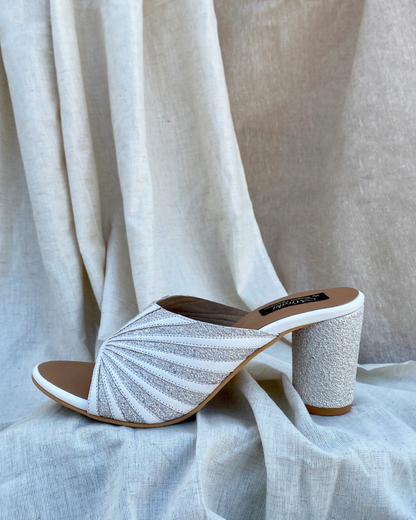 White Pattern Cut Slip Ons With Rounded Heels
